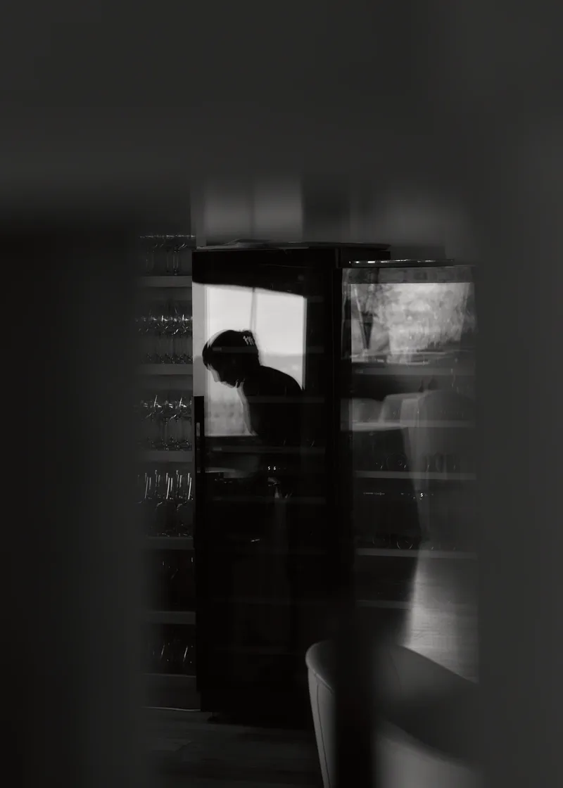 Silhouette behind a glass door, Esperit Roca in Girona, restaurant photography by Wim Jansen Delgado